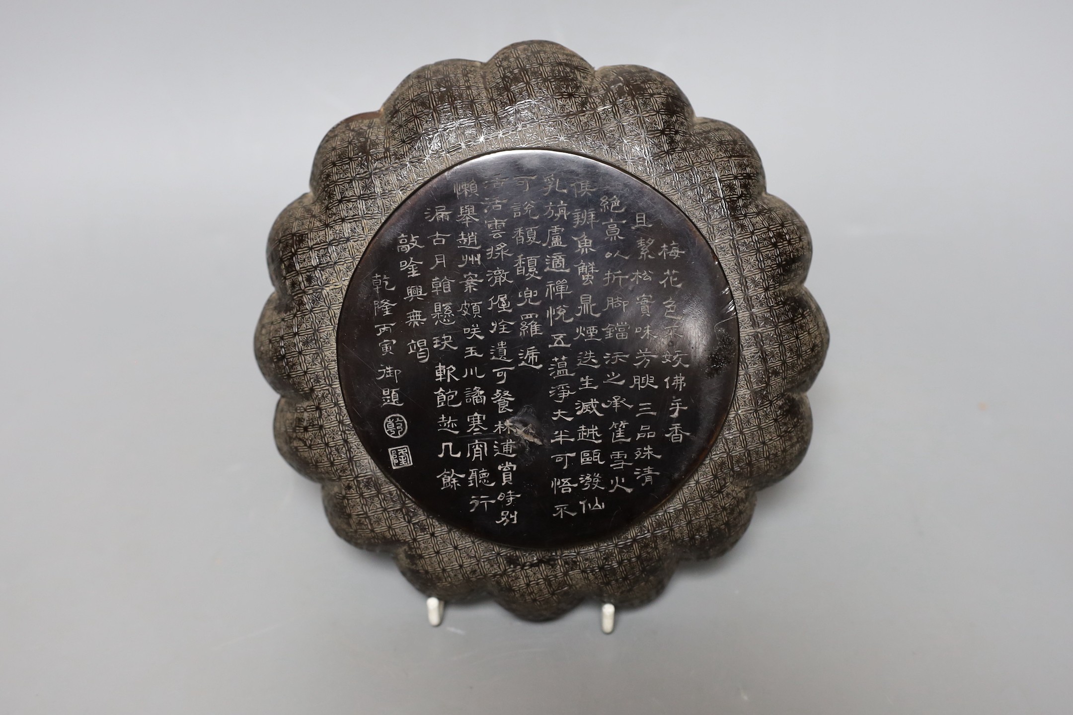 A Chinese inscribed lacquer dish, 19cm